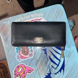 Woman’s Michael Kors wallet in good condition